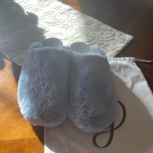 Light blue fur mules .
